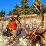 An Elk Ridge Outfitters guest shows off the elk he took down
