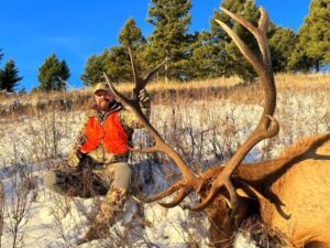 An Elk Ridge Outfitters guest shows off the elk he took down