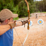 man practicing archery