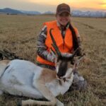 woman posing with antelope she just took down with rifle