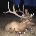 An Elk Ridge Outfitters guests holds up the antlers of the Elk he's successfully hunted