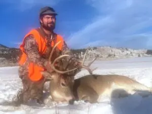 An Elk Ridge Outfitters guest poses with the Antelope he took down during a 2022 hunt